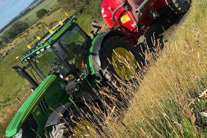 Tractor towing a container